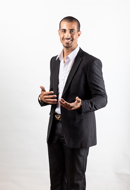 male data scientist professional portrait wearing business attire in office environment